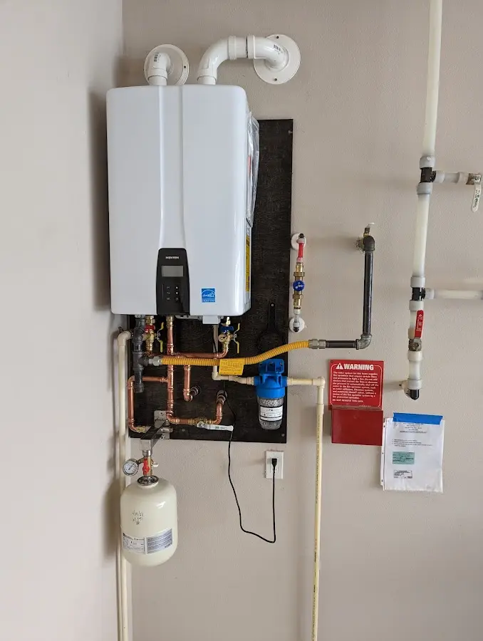 Professional plumber installing copper piping in a Guadalupe home